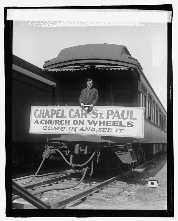 Reverend E.J. McGuinness on board the chapel car St. Paul, 1923.